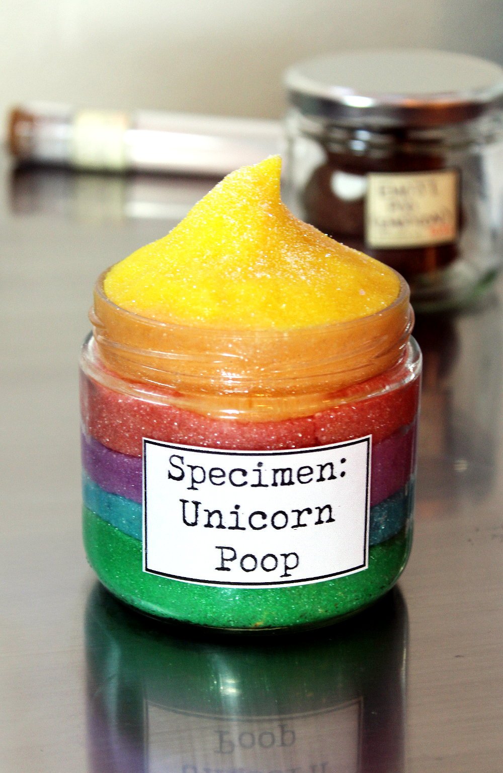 Unicorn Rainbow Poop Moldable Sugar Scrub Recipe! Learn how to make this fun sparkly, glittery rainbow colored moldable sugar scrub with my original semi-solid rainbow moldable sugar scrub recipe that you can mold and shape!