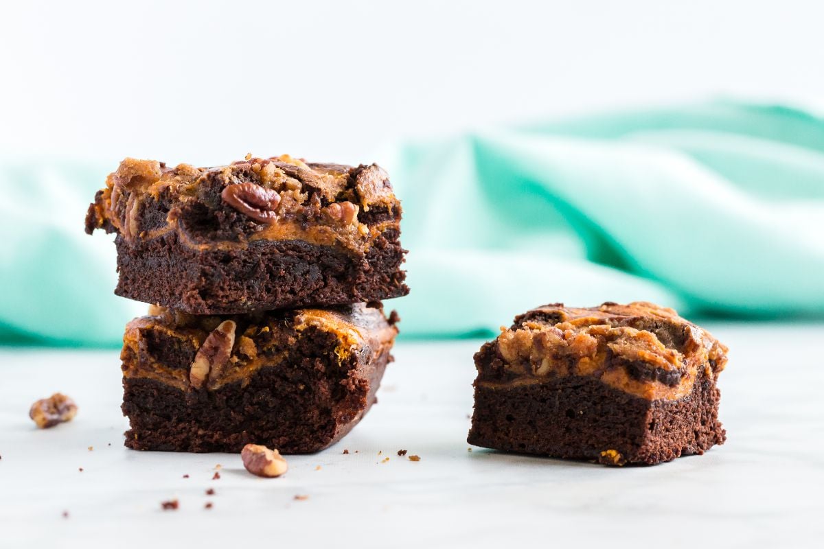 Pumpkin Cheesecake Brownies Recipe with Pecan Streusel. A seasonal fall favorite pumpkin spice dessert recipe with everyone’s favorite - pumpkin spice! Start with a box of your favorite brownie mix (I opt for chewy and extra fudgy) and throw in some canned pumpkin, cream cheese and everyone's fall favorite - pumpkin spice! Then top it all off with some pecan streusel and you've got yourself a dessert worthy of the season!