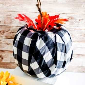 Craft this black and white buffalo check pumpkin decor. This easy craft for adults is an affordable fall decor idea for the home.